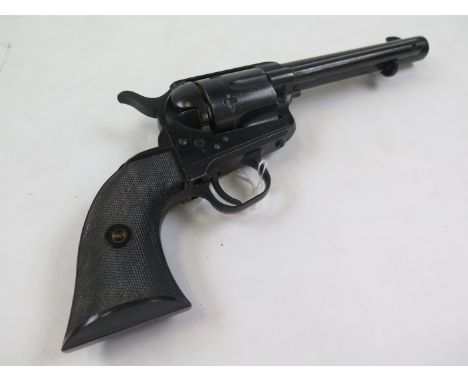 Revolver: A metal model replica of a Colt .45 'Artillery Model' 1874 single action army revolver. Plastic two piece grips. A 