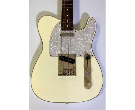 A Japanese made Fender Telecaster 50th Anniversary edition. Serial A025179. With hard case. Some tarnish and wear to hardware