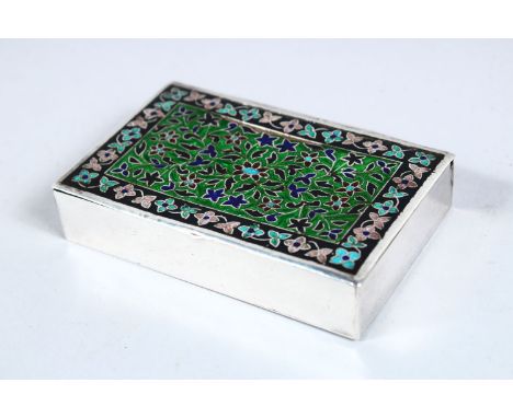 AN INDIAN WHITE METAL &amp; ENAMEL LIDDED BOX, the top with enamel decoration in floral style, 10cm wide x 6cm.