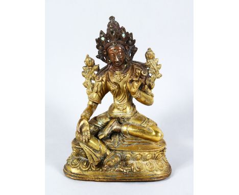 A 18TH / 19TH CENTURY TIBETAN GILT BRONZE FIGURE OF DEITY / BUDDHA, in a seated meditating position upon a formed lotus base,