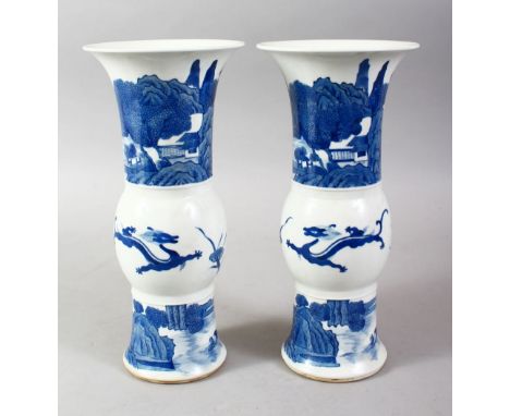 A PAIR OF CHINESE KANGXI STYLE BLUE &amp; WHITE PORCELAIN VASES, the vases decorated with scenes of kylin amongst landscape s
