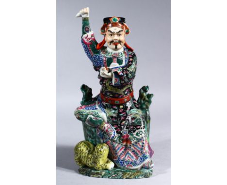 A GOOD 19TH / 20TH CENTURY CHINESE FAMILLE ROSE / VERTE PORCELAIN FIGURE OF AN IMMORTAL &amp; TIGER. the immortal figure seat