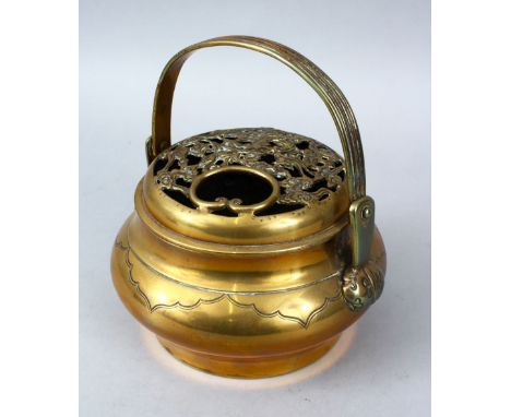 A 19TH / 20TH CENTURY CHINESE BRONZE CENSER,  With a carved and pierced lid with ruyi and floral design, with a hinged handle