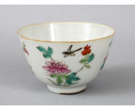 A 19TH CENTURY CHINESE FAMILLE ROSE PORCELAIN CUP, the cup decorated with scenes of birds and flora, the base with an iron re