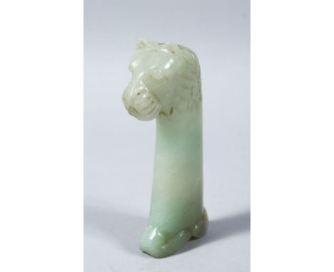 A 19TH CENTURY INDIAN MUGAL CARVED JADE DAGGER HANDLE OF A LION / BEAST, 12cm high x 7cm wide.