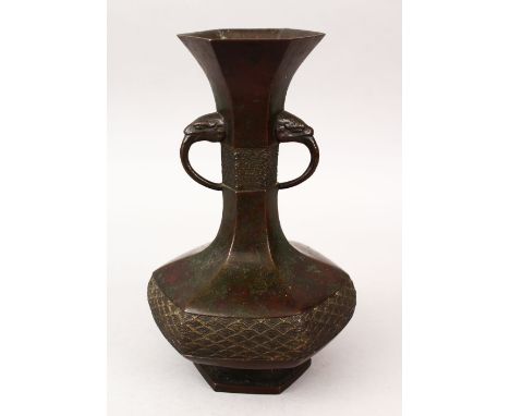 AN 18TH CENTURY CHINESE BRONZE ARCHAIC STYLE TWIN HANDLE VASE, with tin moulded beast handles, with a band of wave borders, 2