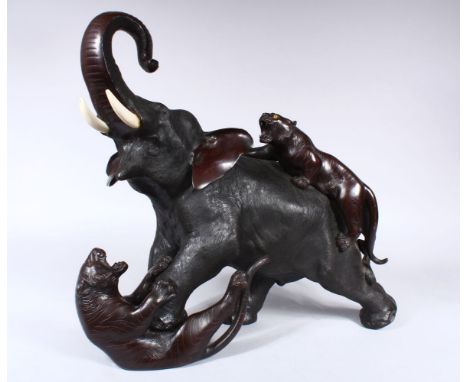 A LARGE JAPANESE MEIJI PERIOD BRONZE OKIMONO ELEPHANT &amp; TIGER GROUP, the elephant in an alarmed position whilst being att