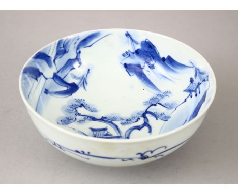 A 19TH CENTURY CHINESE BLUE &amp; WHITE PORCELAIN BOWL, the interior decorated with views of a landscape setting, the exterio