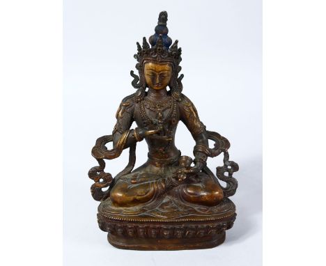 A 19TH CENTURY SINO TIBETAN BRONZE FIGURE OF BUDDHA / DEITY, in a seated meditating position holding a bell and vajra and upo