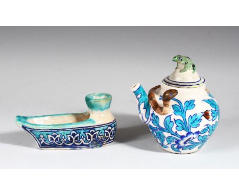 A FINE 19TH CENTURY GLAZED POTTERY BOAT SHAPED OIL LAMP, together with a similar ewer and cover, lamp 15cm long.