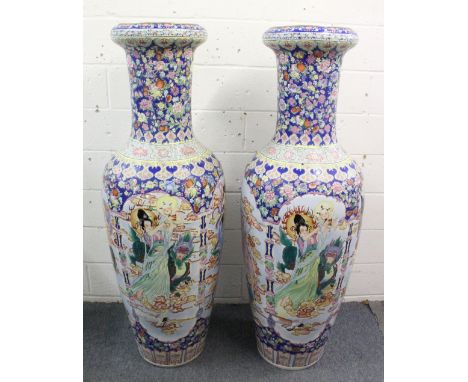 A LARGE PAIR OF 20TH CENTURY CHINESE FAMILLE ROSE FLOOR STANDING VASES,  depicting scenes of figures and dragons with floral 