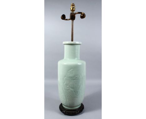 A CHINESE LATE 19TH CENTURY CELADON MOULDED PORCELAIN VASE / LAMP, the body moulded with decoration of a lion dog stood upon 