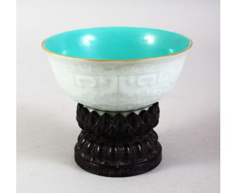 A GOOD CHINESE PALE CELADON YONGZHENG STYLE PORCELAIN BOWL, the exterior of the bowl with moulded archaic style decoration, t