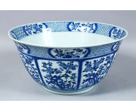 A GOOD LARGE CHINESE KANGXI PERIOD BLUE &amp; WHITE PORCELAIN BOWL, the body of the bowl decorated with panels of native flor