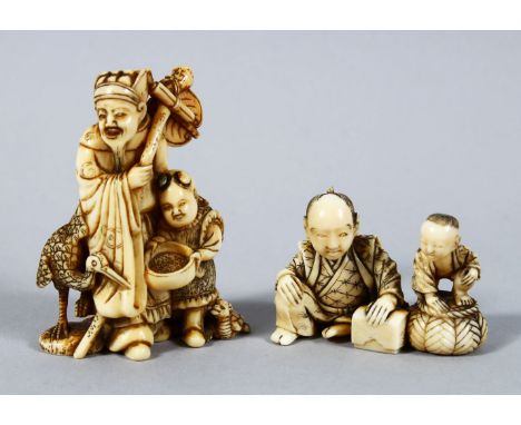 TWO JAPANESE MEIJI PERIOD CARVED IVORY OKIMONO / NETSUKE, the first being a netsuke; a japanese lucky god with a deer and boy