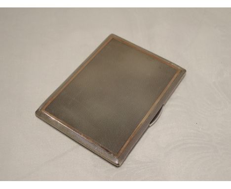 A silver cigarette case having engine turned decoration and rose metal detail, London 1948, A Nicholls & Son,  approx 177.8g