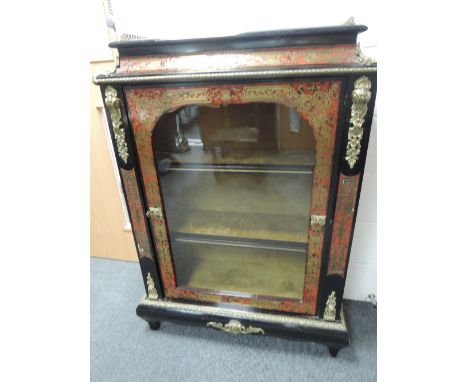 An early 20th century ebonised display cabinet of inlaid boulle design having ormolu style gallery and applique  frame with c