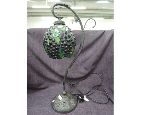 A modern Tiffany style table lamp having hanging berry glass shade on naturalistic baseCONDITION REPORT - no apparant damage 