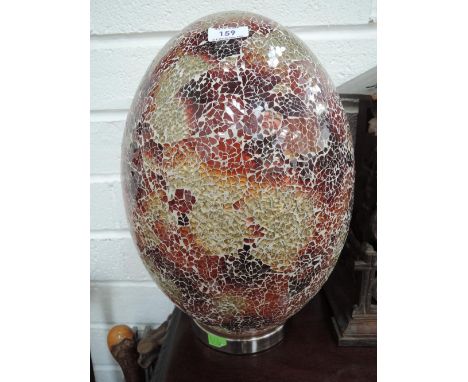 A modern crackle glass table lamp modelled as an egg