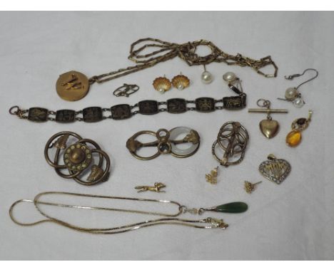 A selection of vintage and modern yellow metal jewellery including earrings, locket, pendants, bracelet, brooches etc