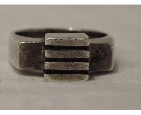 An HM silver dress ring of stylised architectural form designed by Ian Lawrence,  size L