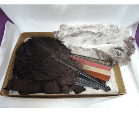 Four lady's vintage fans two including two printed on paper with scenes on wooden handles and two ostrich feather in cream an