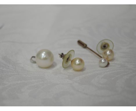 A cultured pearl pendant on a 9ct white gold mount and loop, pair of cultured pearl stud earrings and stick pin