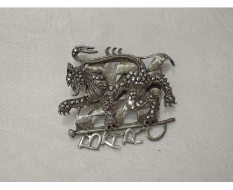A white metal brooch stamped Sil regarding the British Automobile Racing Club modelled as a chequered flag with marcasite set