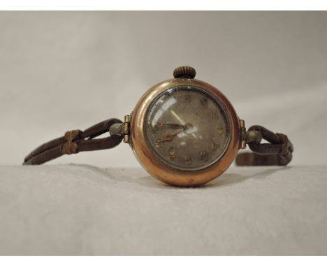 A lady's vintage 9ct gold wrist watch by Cyma having Arabic numeral dial to circular face on a tan leather strap