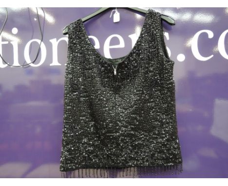 A vintage 1960s ladies heavily beaded black wool top.
