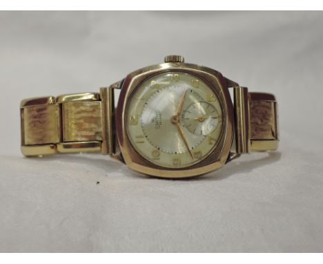 A gents 9ct gold wrist watch by Smiths having Arabic numeral dial with subsidiary seconds to engine turned face in a square c