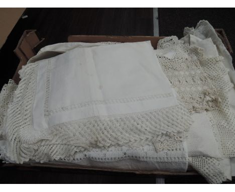 A selection of vintage linen, table cloths, doilies, placemats etc including cut work, bobbin lace and embroidery