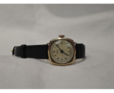 A lady's 9ct gold vintage wrist watch by Limit having Arabic numeral dial to circular face on later black leather strap