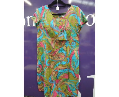 A vintage 1960s dress by Frank Usher, having bow detail to front and bright psychedelic style print.