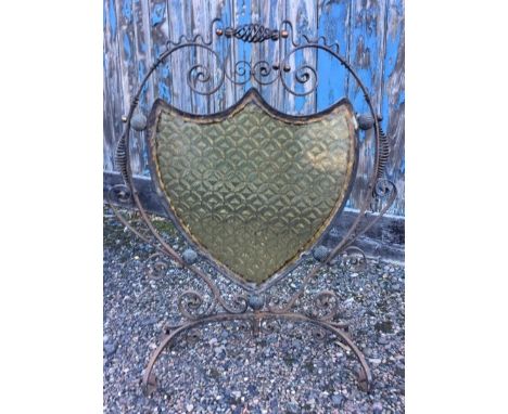A Victorian Arts and Crafts wrought iron, copper and amber glass fire screen