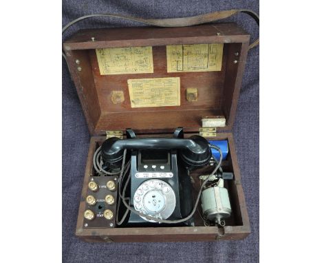A vintage portable emergency telephone, No 254/FH1 in fitted mahogany box with instructions, of bakelite design