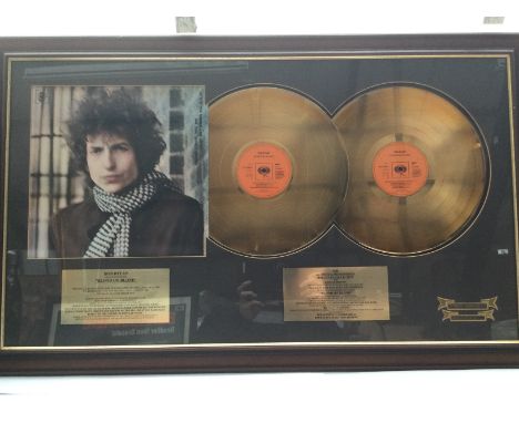 A framed and glazed limited edition double gold disc display for the Bob Dylan LP 'Blonde On Blonde'. Comes with hand numbere