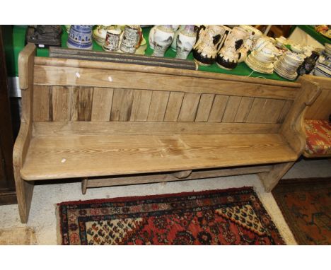 A 19th Century pine pew   CONDITION REPORTS  The bench has signs of being left outside.  Various warped damage, very grey in 