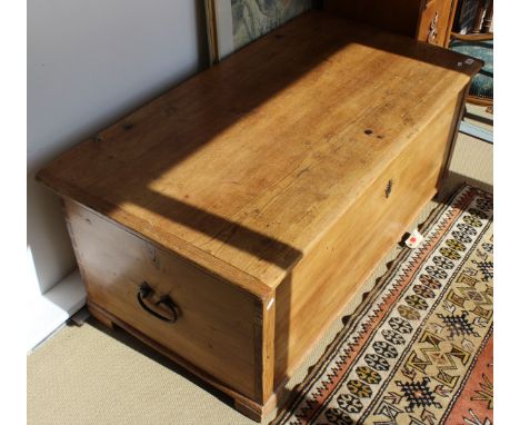 A large pine rectangular trunk, the lid opening to reveal candle box on block feet