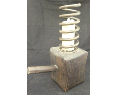 A candlestick in the form of a coil on a pine block with a pine handle, together with an oak and iron bound butter barrel