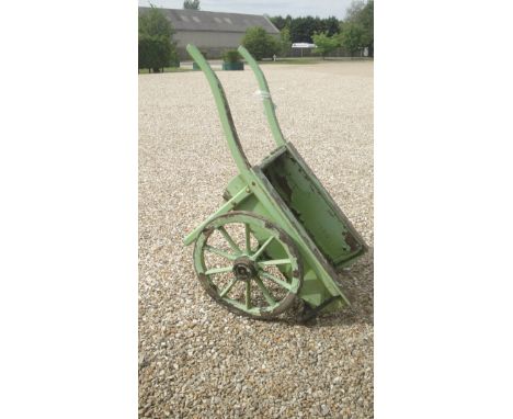 A vintage hand cart with iron bound wheels