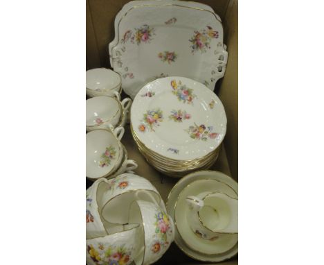 A Coalport relief decorated and floral spray printed and painted part tea service (12 place settings) including cups and sauc