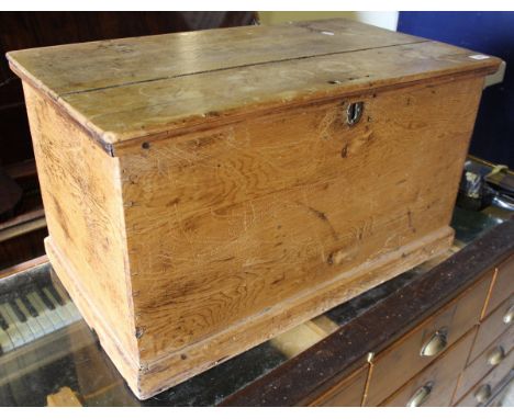 A pine trunk together with another smaller example and a painted two drawer side table