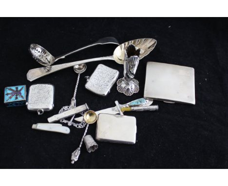 A collection of small silver wares to include a fruit spoon, taper vase, two vesta cases, card case, cigarette case, sifter s