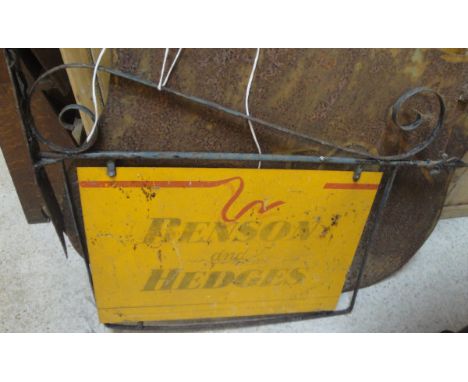 A Benson & Hedges enamel painted sign in a shop hanging fitting, together with a Lipton's painted sign