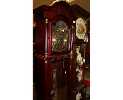 A modern mahogany long case clock with brass dial together with an early 20th Century oak long case clock with painted dial i