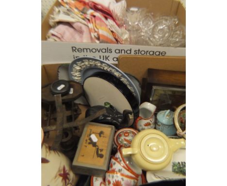 A box of various glass ware and linen and a box containing an oak cased mantle clock, various china wares, scales, etc