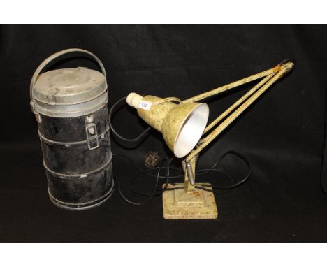 An anglepoise lamp by Herbert Henry with a two-stepped base, together with a cylindrical insulated tin, the lid opening to re
