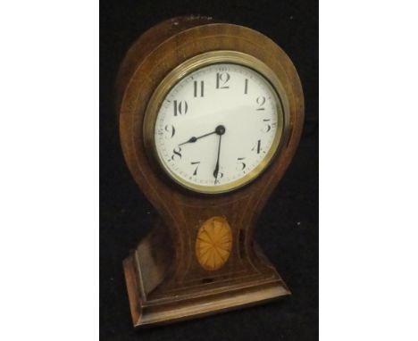 A mahogany cased balloon shaped mantel clock with Swiss made Beuren movement with Arabic numerals to the enamel dial, the bod