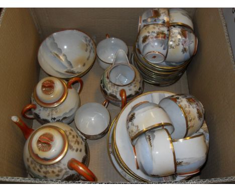 A Japanese eggshell china part tea service decorated with geishas and garden comprising tea cups, tea plates, side plates, a 